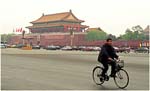 007. Cyclist passing Tiananmen Square opposite the Forbidden City