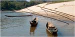 016. Boats moored beside the Mekong at Ban Bow